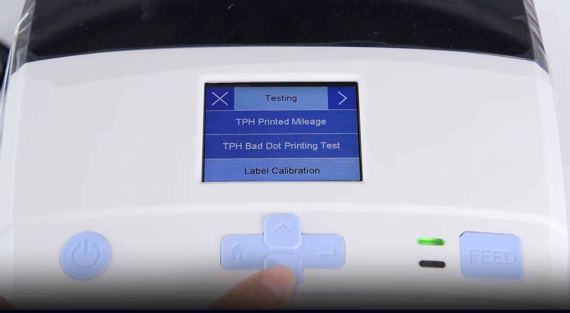 א close-up of a machine's digital interface showing a testing menu.